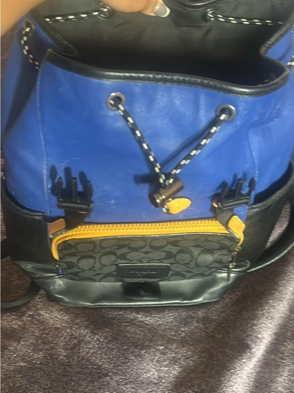 Coach Men's Blue and Black Logo Panel Flap Backpack with Gold Accents